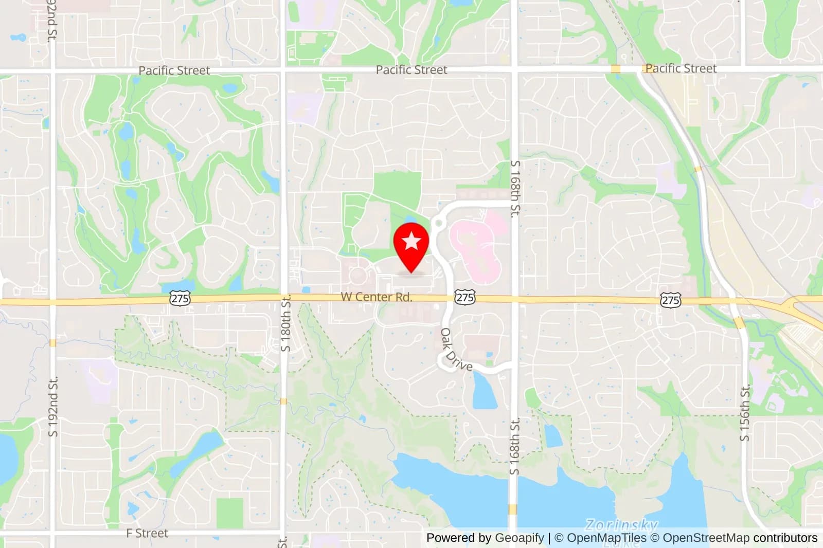 Map of West Omaha with a red marker near West Center Road and Oak Drive
