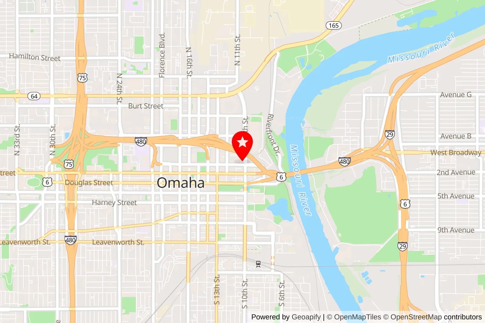 Map of downtown Omaha with a red location pin near the Missouri River