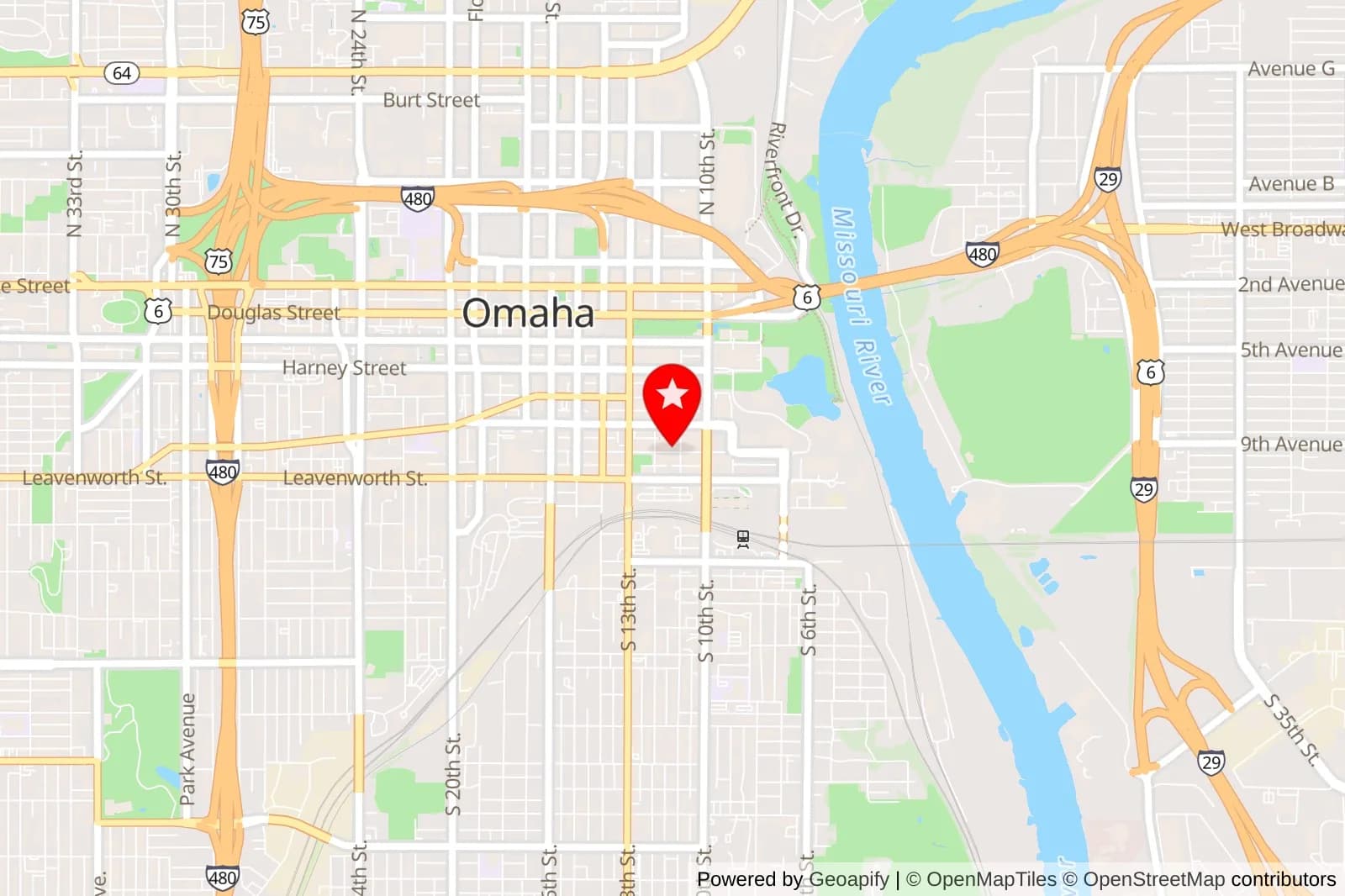 Map of downtown Omaha with a red star marker near the Missouri River
