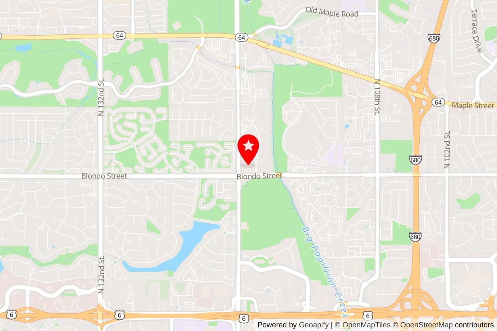 Map showing a red star marker near Blondo Street and North 120th Street in Omaha